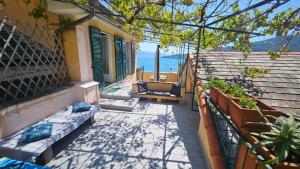 a balcony of a house with a view of the ocean at Ampia casa marinara con meravigliosa terrazza vista mare Da Mario e Rosanna in Portovenere