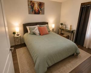 a bedroom with a large bed with two lamps at Ocean Breeze Stay Near Airport LAX & Stadium in Los Angeles