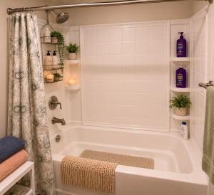 a bathroom with a white tub and a shower at Ocean Breeze Stay Near Airport LAX & Stadium in Los Angeles +11 photos