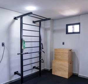 a gym room with a rack and a box at Il Divo Boutique Hotel in Ciudad del Este