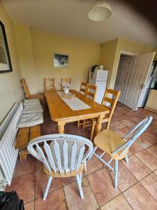 a dining room with a table and chairs at The Yellow Bollard in Galway