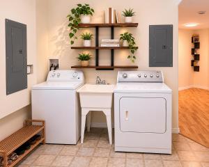a kitchen with two washes and a sink at Bright & Cozy Private 1BR Suite in Whitehorse +4 photos