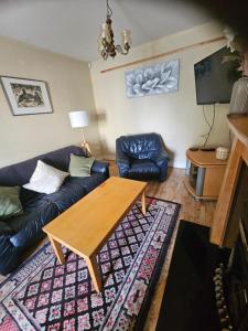 a living room with a couch and a table at The Yellow Bollard in Galway