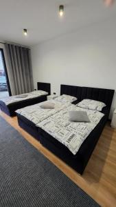 Ein Bett oder Betten in einem Zimmer der Unterkunft ANPOL komfort