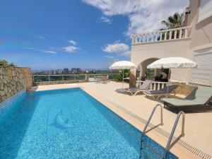 a swimming pool on the roof of a house at Jasminpark Villa in Alanya