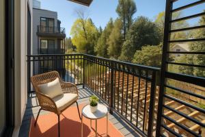 a balcony with a chair and a table at The Manor - Chevy Chase in Chevy Chase