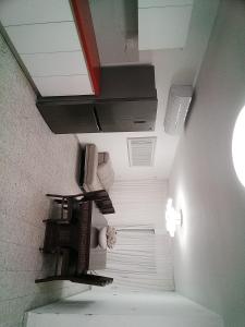 a room with a hallway with shelves and a ceiling at Be Netivei BE NETIVOTI in Netivot