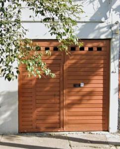 a wooden garage door on a house at Estadio GNP and Airport AICM in Mexico City