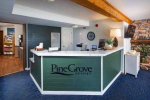 a pine grove resort reception desk in a lobby at Pine Grove Resort in Ephraim +68 photos