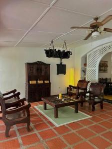 a living room with chairs and a coffee table at Templo Verde Eco hostal in Minca