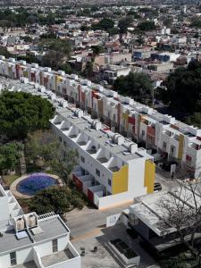 an aerial view of a building with a city in the background at Habitaciones cómodas en Coto Galeana Guadalajara in Guadalajara