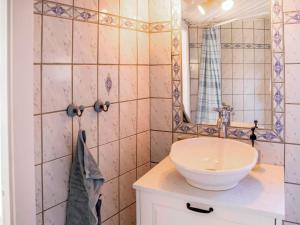 a bathroom with a sink and a mirror at Historic Gem in Samsø in Brundby +22 photos