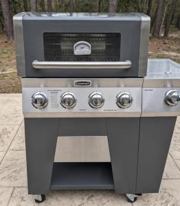 a gas grill with a sink on top of it at Arcade Shuffleboard Poker Firepit Grill @ Battery in Marietta