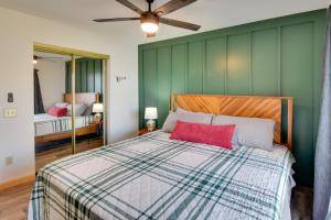 a bedroom with green walls and a bed with a red pillow at 3-Unit Combo w/ Dock on Lake Keowee - Hike & Fish! in Seneca