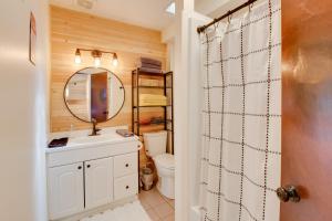 a bathroom with a toilet and a sink and a mirror at 3-Unit Combo w/ Dock on Lake Keowee - Hike & Fish! in Seneca +46 photos