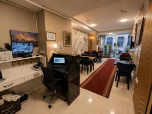 an office with a desk and chairs in a room at ISTANBUL STAY Boutıque Hotel in Istanbul
