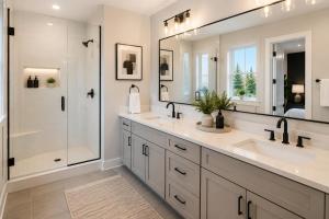 a bathroom with two sinks and a shower at Collin Creek Executive Residences in Plano
