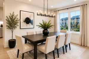 a dining room with a table and chairs at Collin Creek Executive Residences in Plano