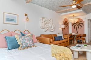 a living room with a bed and a couch at Penthouse Oceanfront Studio VR + Mural + Minibar in Myrtle Beach +48 photos