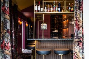 a row of stools at a bar at Villa Dorothea in Lisbon