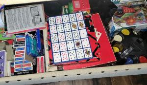 a shelf filled with lego games and other toys at Spacious Family Gathering Space Privacy Zones Quiet, Convenient Neighborhood in Middletown +29 photos