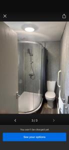 a bathroom with a shower and a toilet at Hunters lodge in Blackpool