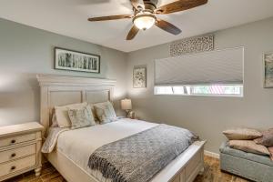 a bedroom with a bed and a ceiling fan at Pool & Dual Decks! Modern Trinity River Retreat in Lewiston