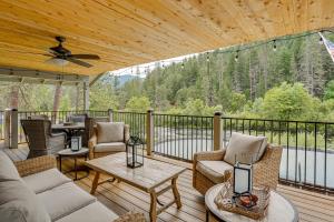 a screened porch with a couch and chairs on a deck at Pool & Dual Decks! Modern Trinity River Retreat in Lewiston