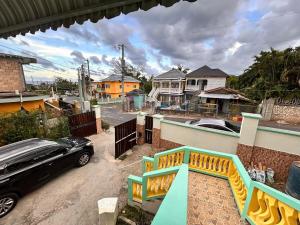 a car parked in the driveway of a house at Mammee Bay Hideaway in Ocho Rios