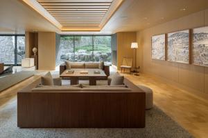 a living room with a couch and a table at Banyan Tree Higashiyama Kyoto in Kyoto