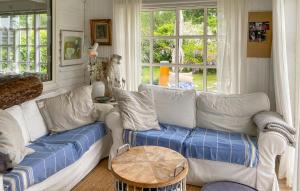 a living room with a couch and a table at Gorgeous Home In Hundested With Wifi in Hundested