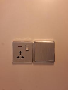 a light switch on a wall in a room at Thundi Ocean View in Maalhos