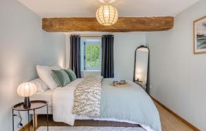 a bedroom with a bed and a window at Maisons Falourdel in Soulles +26 photos