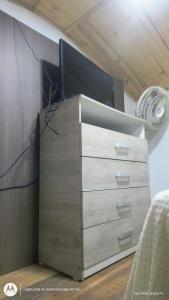 a dresser in a room with a dresserigunigunigunigunigunigun at Villa chava mesanine in Ibagué