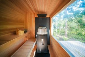 a small kitchen with a stove and a window at Hakuba Bubu Chalet by Jade Villa in Hakuba +46 photos
