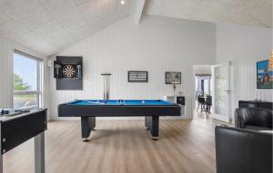 a living room with a pool table in it at Pet Friendly Home In Faaborg With Sauna in Faaborg