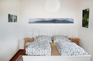מיטה או מיטות בחדר ב-Casa Emilia