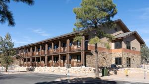 a building with a tree in front of it at Maswik Lodge - Inside the Park in Grand Canyon Village