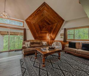 a living room with a couch and a table at Gateway to Glacier in Columbia Falls