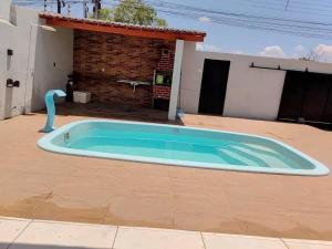 a large swimming pool in the backyard of a house at Casa em Piranhas com piscina in Piranhas