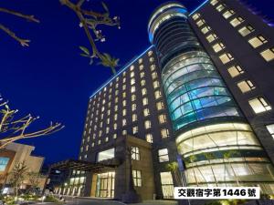 a tall building with a lot of windows at Grand Bay Resort Hotel in Hengchun South Gate