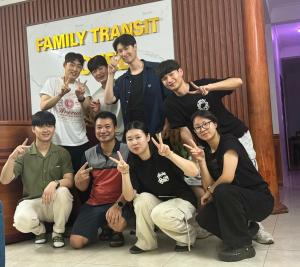a group of young men posing for a picture at Family Transit Hotel in Thach Loi