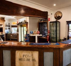 a bar in a room with a counter top at Golden Age Hotel in Omeo
