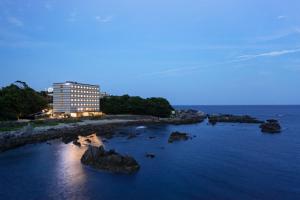 a building sitting on top of a body of water at Fairfield by Marriott Wakayama Kumano Kodo Susami in Susami