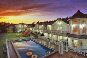 a large house with a swimming pool in the backyard at Taean Modern186 Pension in Taean