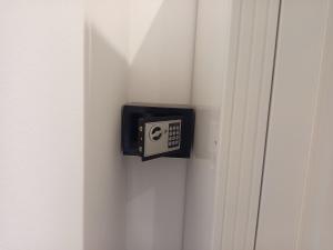 a black electrical outlet on a white door at Gabala A frame Guest villa in Gabala