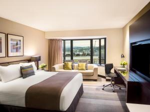 a hotel room with a bed and a television at InterContinental Wellington by IHG in Wellington +240 photos