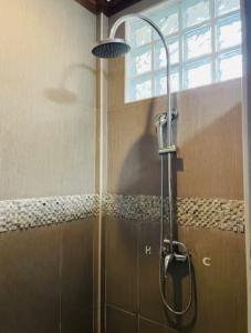 a shower in a bathroom with a glass door at Baha Bar in San Juan +43 photos