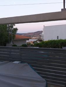 a view from the balcony of a house at Parishouse by zarkco in Porto Rafti +4 photos