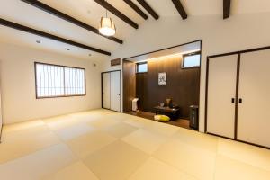 a large empty room with a toilet in it at Irodori Hotel AKANE in Fukuoka